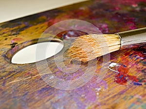 Brush and palette with oil paints