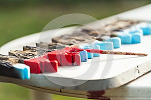 Brush on a polystyrene surface on a table outdoors photo