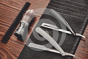 Brush and razor for shaving beard. Concept background of hair salon men, barber shop