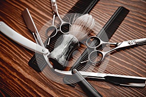 Brush and razor for shaving beard. Concept background of hair salon men, barber shop