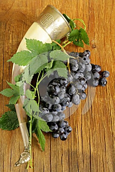 Brush ripe sweet grapes with a traditional drinking horn