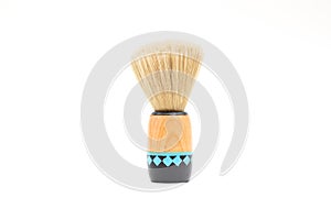 Brush for shaving beard with wooden handle isolated on white background