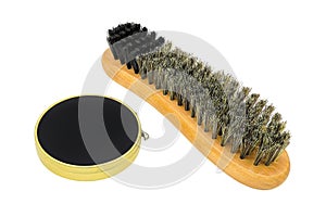 Brush and shoe polish isolated on white background