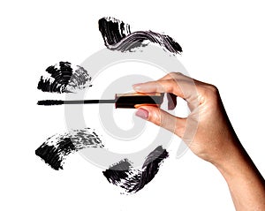 Brush stroke of black shade of mascara on white