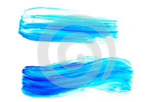 Brush strokes with blue oil paint on white isolated background.