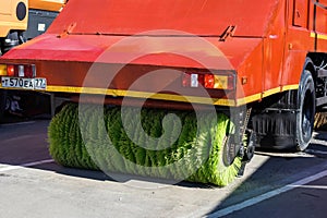 Brush on sweeper vehicle for cleaning streets and roads. special truck with round brush on the back