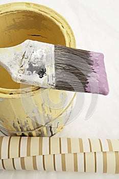 Brush to side on paint can