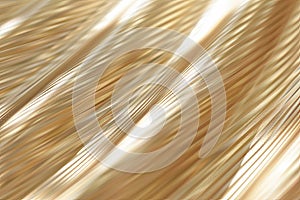 Brushed gold metallic abstract texture closeup.
