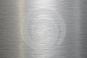 Brushed metal texture with fine horizontal lines and a soft, diffused vertical light reflection