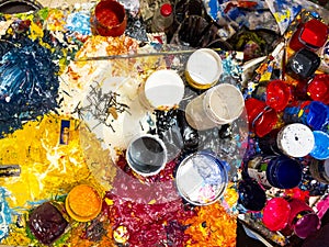 Brushes, palette and paints captured from above