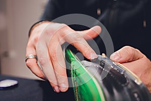 Brushes, wax, boots. applying cream with your finger. Shoe repair.