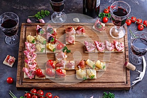 Brushetta or authentic traditional spanish tapas set for lunch table. Sharing antipasti on party or summer picnic time