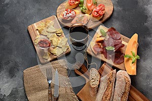 Brushetta or traditional Spanish tapas. Appetizers with Italian antipasti snacks.