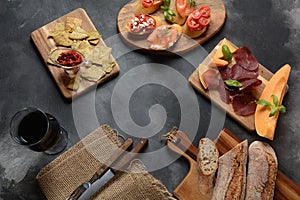 Brushetta or traditional Spanish tapas. Appetizers with Italian antipasti snacks.