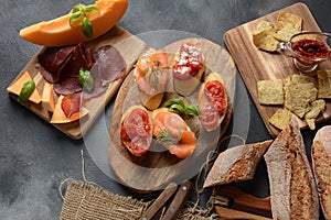 Brushetta or traditional Spanish tapas. Appetizers with Italian antipasti snacks.