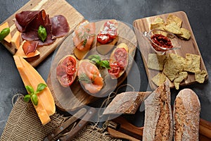 Brushetta or traditional Spanish tapas. Appetizers with Italian antipasti snacks.