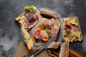 Brushetta or traditional Spanish tapas. Appetizers with Italian antipasti snacks.