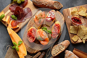 Brushetta or traditional Spanish tapas. Appetizers with Italian antipasti snacks.