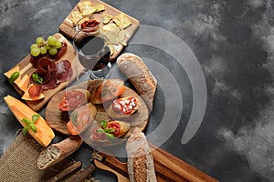 Brushetta or traditional Spanish tapas. Appetizers with Italian antipasti snacks.