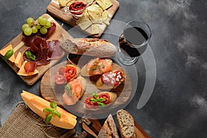 Brushetta or traditional Spanish tapas. Appetizers with Italian antipasti snacks.