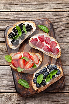 Brushetta or traditional spanish tapas with various berries