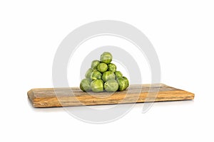 Brussel sprouts on a wooden board