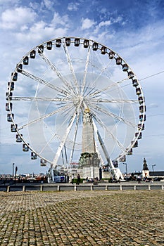 Brussels, Belgium, 10/14/2019: Ferris wheel in the center of a European city. Vertical