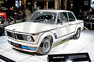 Vintage white iconic BMW 2002 Turbo 1973 Ginion Classics glossy and shiny old classic retro car at Brussels Motor Show