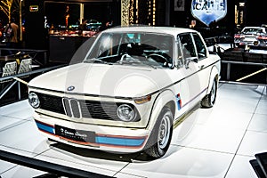 Vintage white iconic BMW 2002 Turbo 1973 Ginion Classics glossy and shiny old classic retro car at Brussels Motor Show