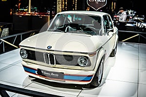 Vintage white iconic BMW 2002 Turbo 1973 Ginion Classics glossy and shiny old classic retro car at Brussels Motor Show