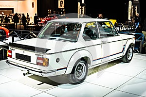 Vintage white iconic BMW 2002 Turbo 1973 Ginion Classics glossy and shiny old classic retro car at Brussels Motor Show