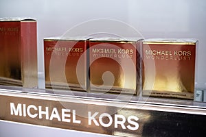 Michael Kors Wonderlust perfume on the shop display for sale, fragrance created by Michael Kors