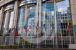 BRUSSELS, BELGIUM, June 23, 2023, Waving flags in front of the European Parliament building in Brussels.