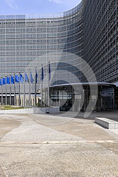 Blue flags of Europe in front of Berlaymont, seat of the European Commission, Brussels, Belgium photo