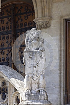 Stone lion with coat of arms of Brussels in front of Town Hall in Grand Place, Brussels, Belgium