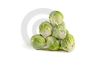 Brussels sprouts, isolate. Fresh, small Brussels sprouts stacked in a stack on a white isolated background.
