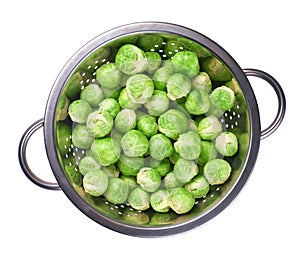Brussels sprouts in metal bowl isolated on white background, top view