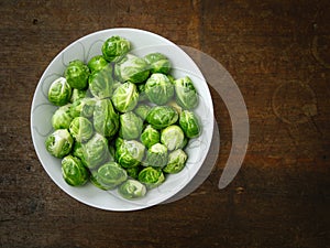 Brussels sprouts on old wood table