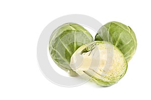 Brussels sprouts on a white background. Fresh small Brussels sprouts, cut in half, Brussels sprouts texture