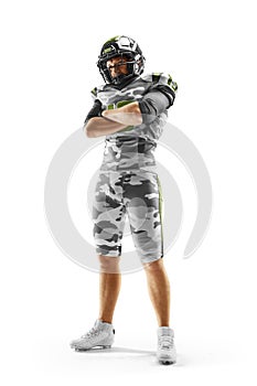 Brutal an American football player stands in white background. Arms-standing. Sports emotions