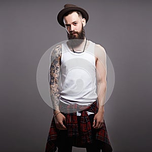 Brutal bearded boy with tattoo