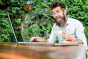 Brutal bearded hipster at coffee break. happy man working on laptop. office worker. Successful businessman. agile