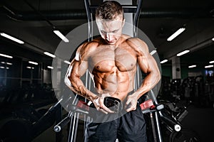 Brutal bodybuilder powerful training arms, pectorals and shoulde