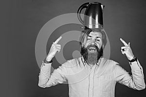brutal caucasian hipster with beard in shirt hold electric kettle, odern life