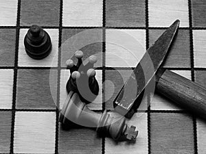 Brutal Checkmate: Hammer Next To A Defeated King On A Chess Board, Monochrome