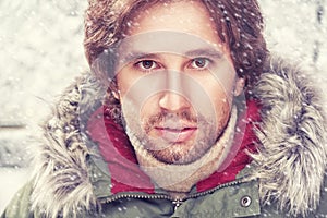 Brutal face of man with beard bristles winter