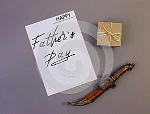 .Brutal greeting card, banner with text- happy father`s day, on a gray background.