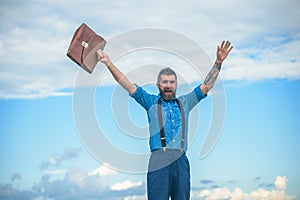 Brutal happy male. Vintage fashion bag. Bearded man. Mature hipster with beard. Bearded man with retro briefcase. Going