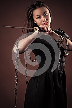 Brutal korean girl with sword in hands