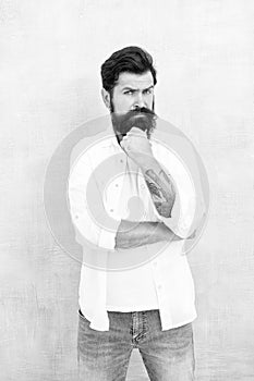 Brutal macho gray background. Casual style daily life. bearded man radiate masculinity. physical attractiveness